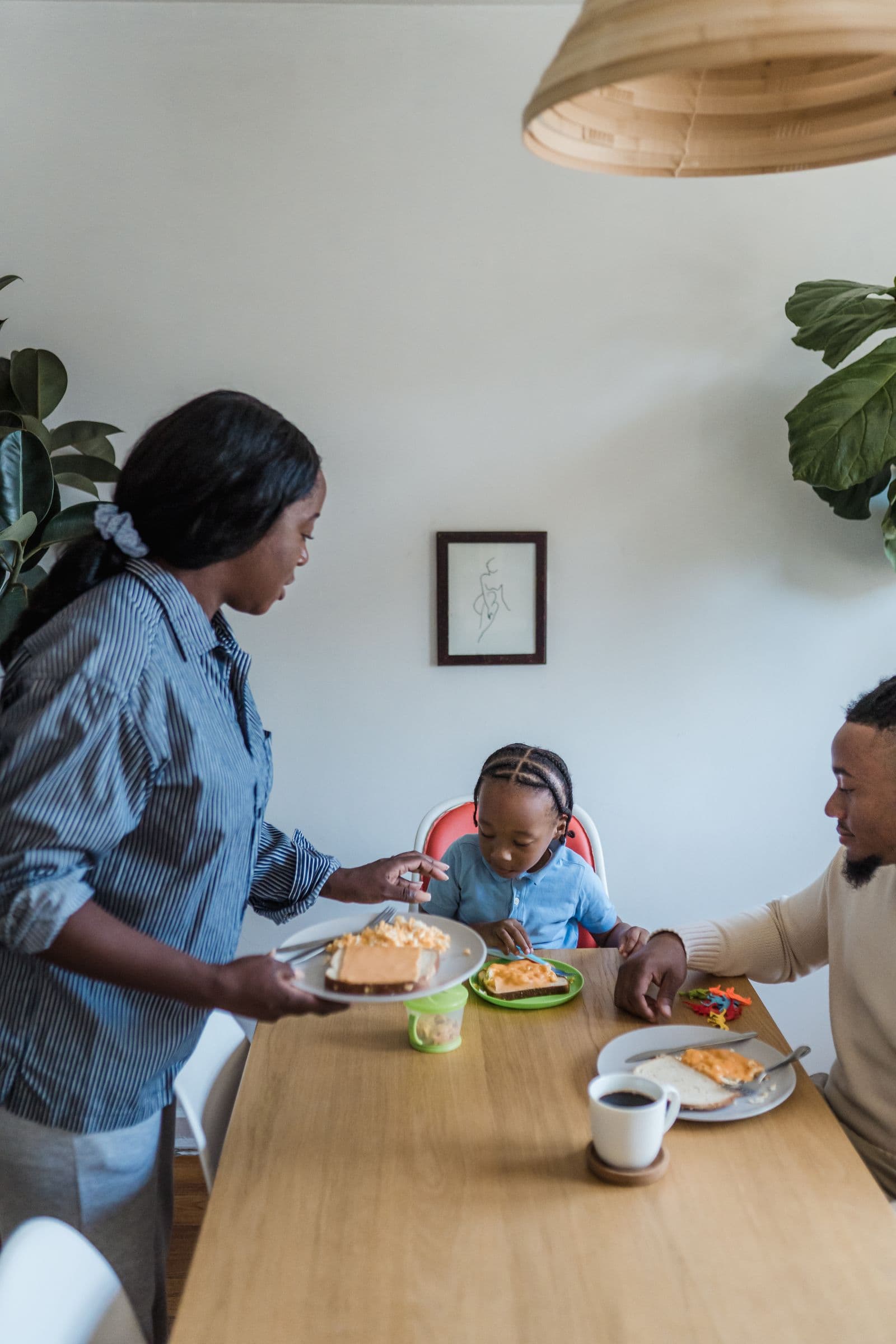A family having breakfast together at the kitchen table